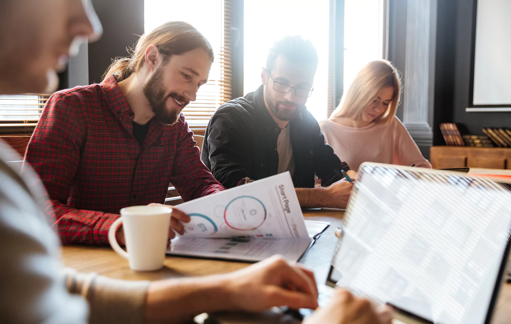 SEO professionals discussing strategies in a meeting