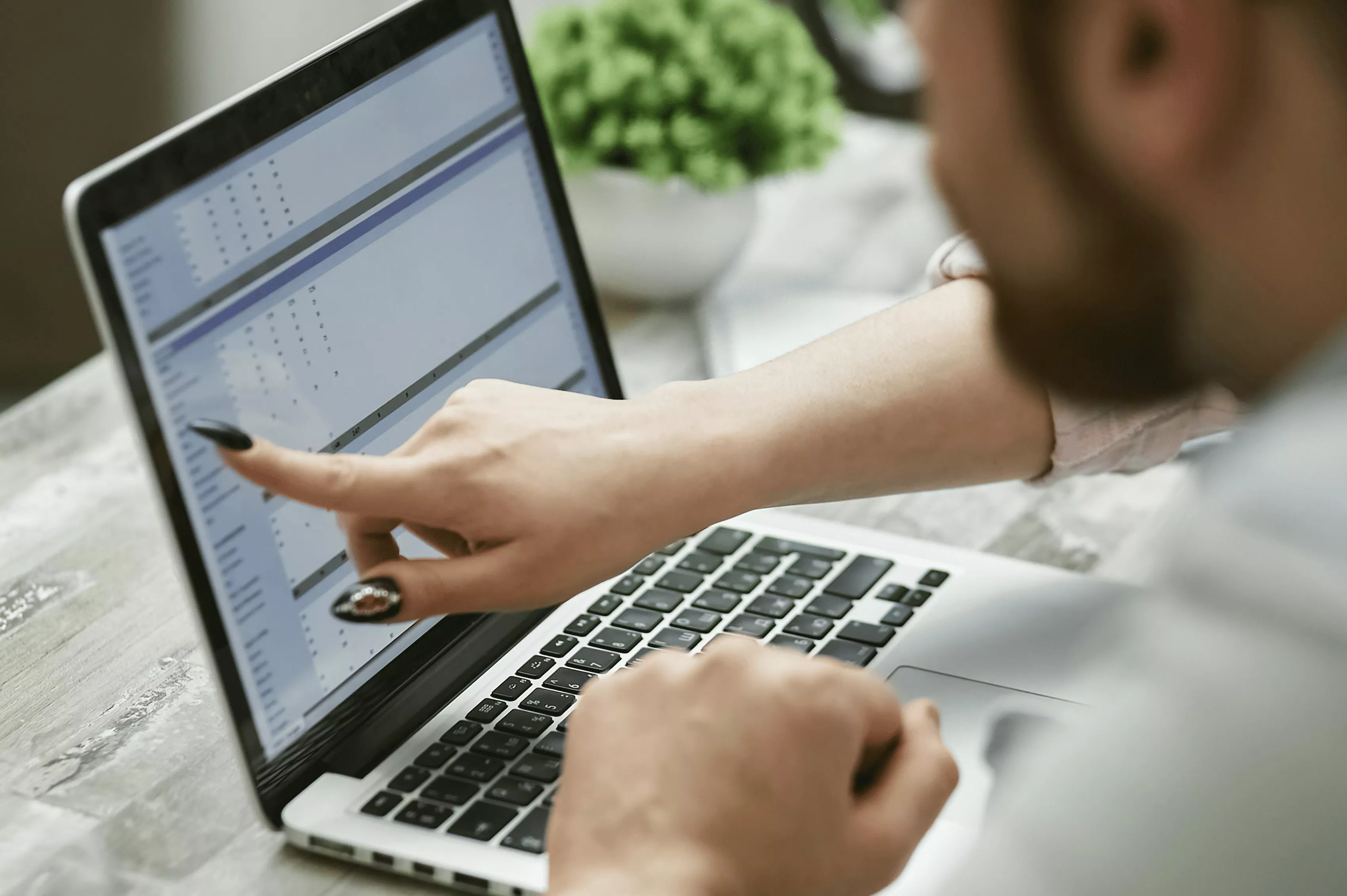 Local SEO guide hero image Small business owner reviewing local search rankings on laptop